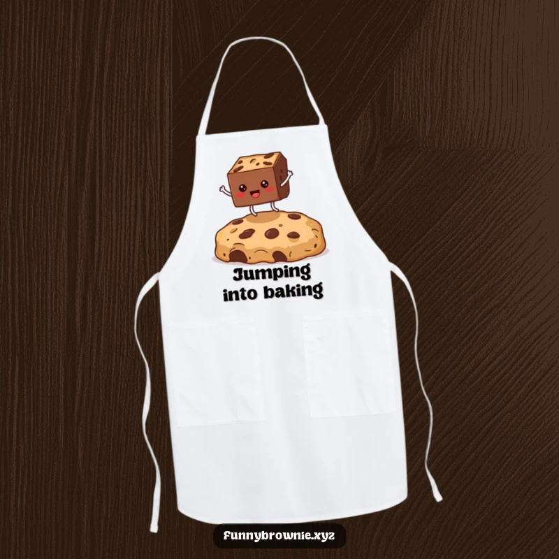 Funny apron showing a square brownie character with legs enthusiastically jumping over a giant cookie crumb, perfect for a humorous kitchen.