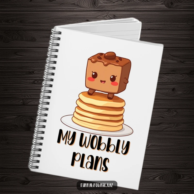 Funny notebook with a brownie character grinning while balancing on a stack of wobbly pancakes, great for jotting down breakfast thoughts.