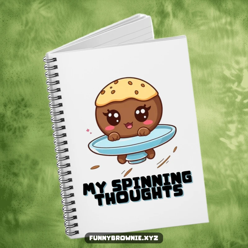 Funny notebook with a round brownie character with googly eyes spinning on a plate, great for jotting down whimsical thoughts.