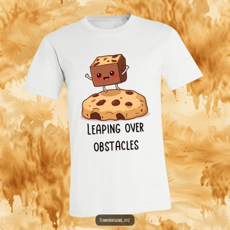 Funny t-shirt showing a square brownie with legs enthusiastically jumping over a giant cookie crumb, promoting a sense of fun.